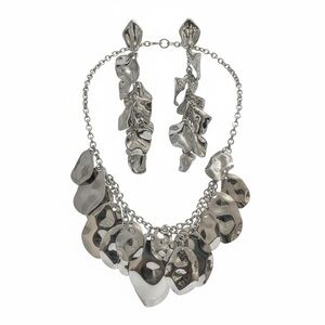 Bold silver-tone statement bib necklace with matching earrings
NWOT
